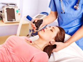 Patient wearing anesthesia mask at hospital.